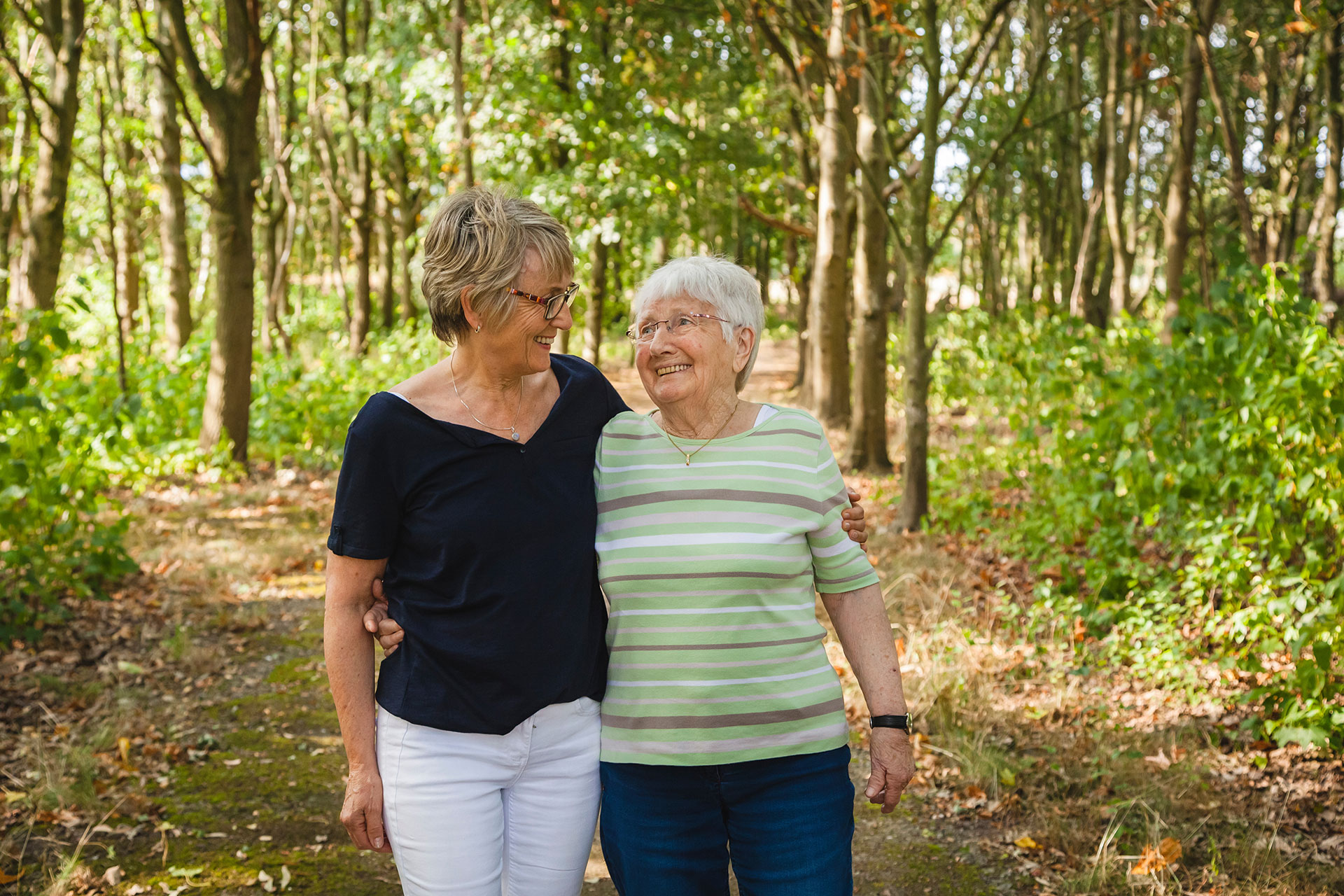 Resident walking with family member